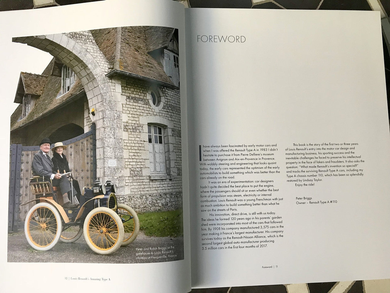 Open book foreword page with vintage vehicle photo and paragraph text