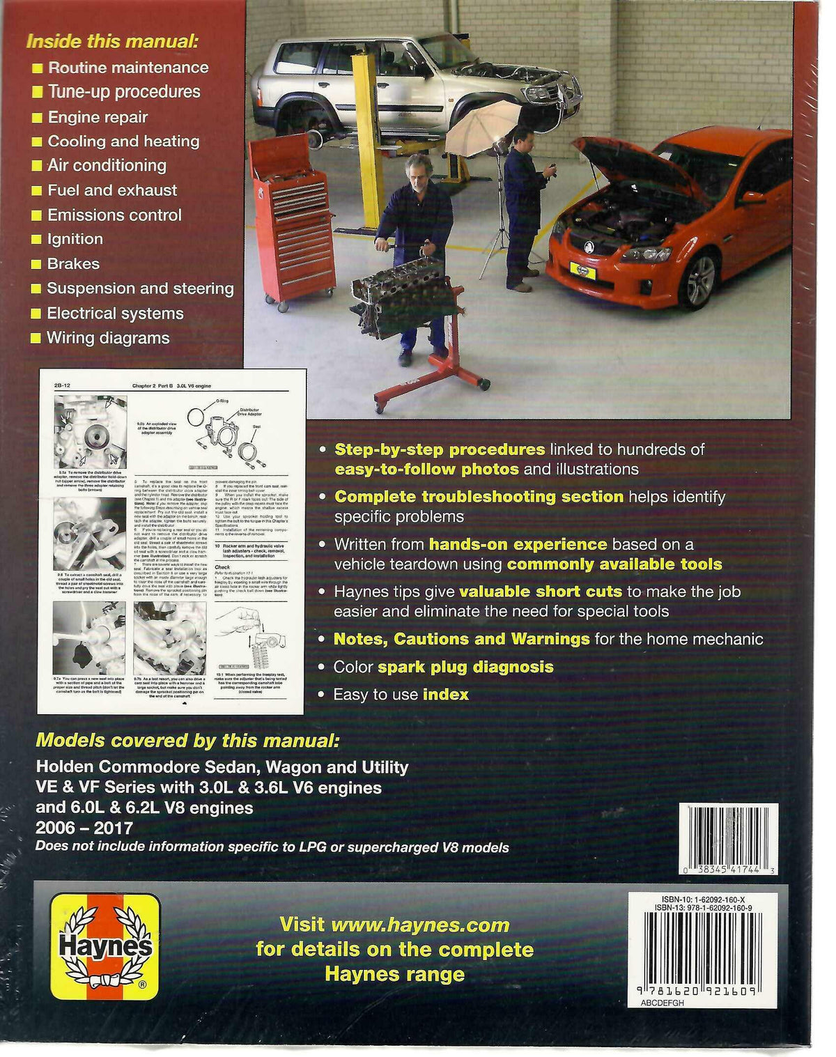 Automotive repair manual book with engine diagrams and vehicle cover photos