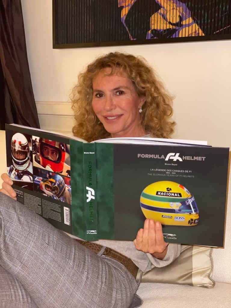 Helmet-themed hardcover box held in hands, showing a yellow helmet graphic on the front.