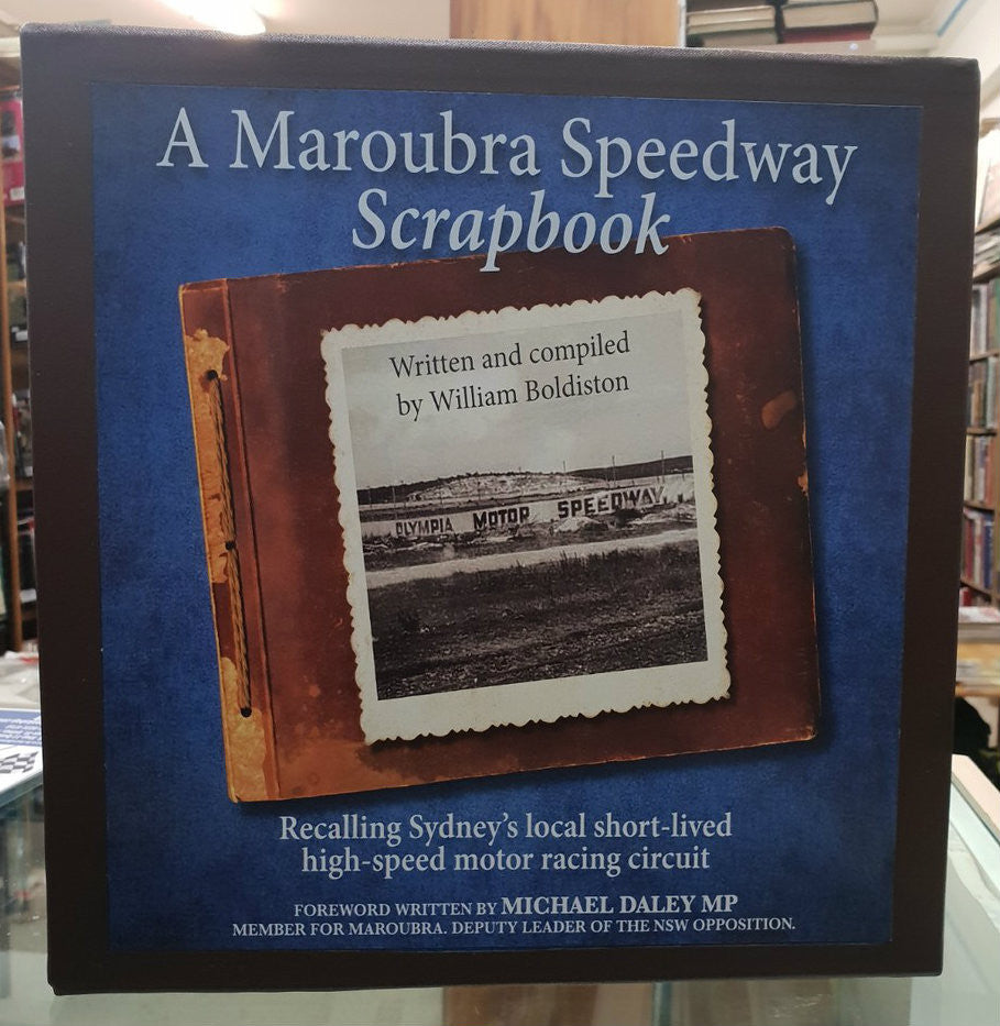 Leatherbound scrapbook with blue cover and brown framed photo on front