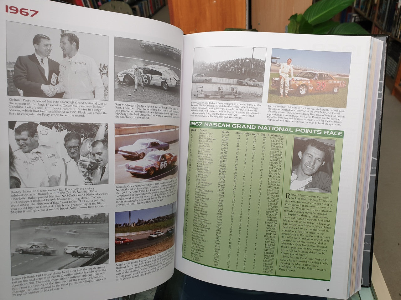 Hardcover NASCAR history book open to 1967 page with race photos and green points list