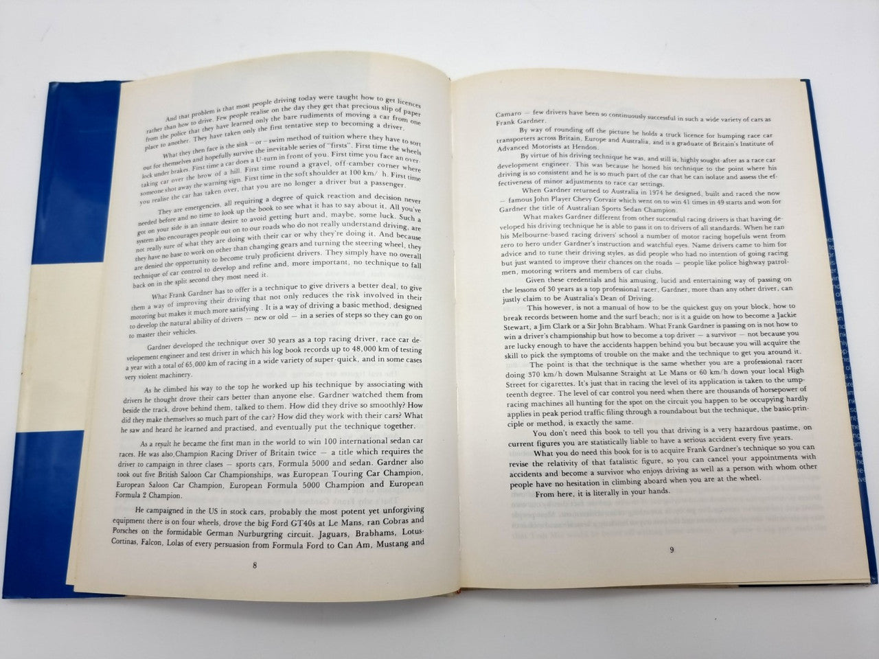 Driving survival book open to chapter text pages with multiple paragraphs