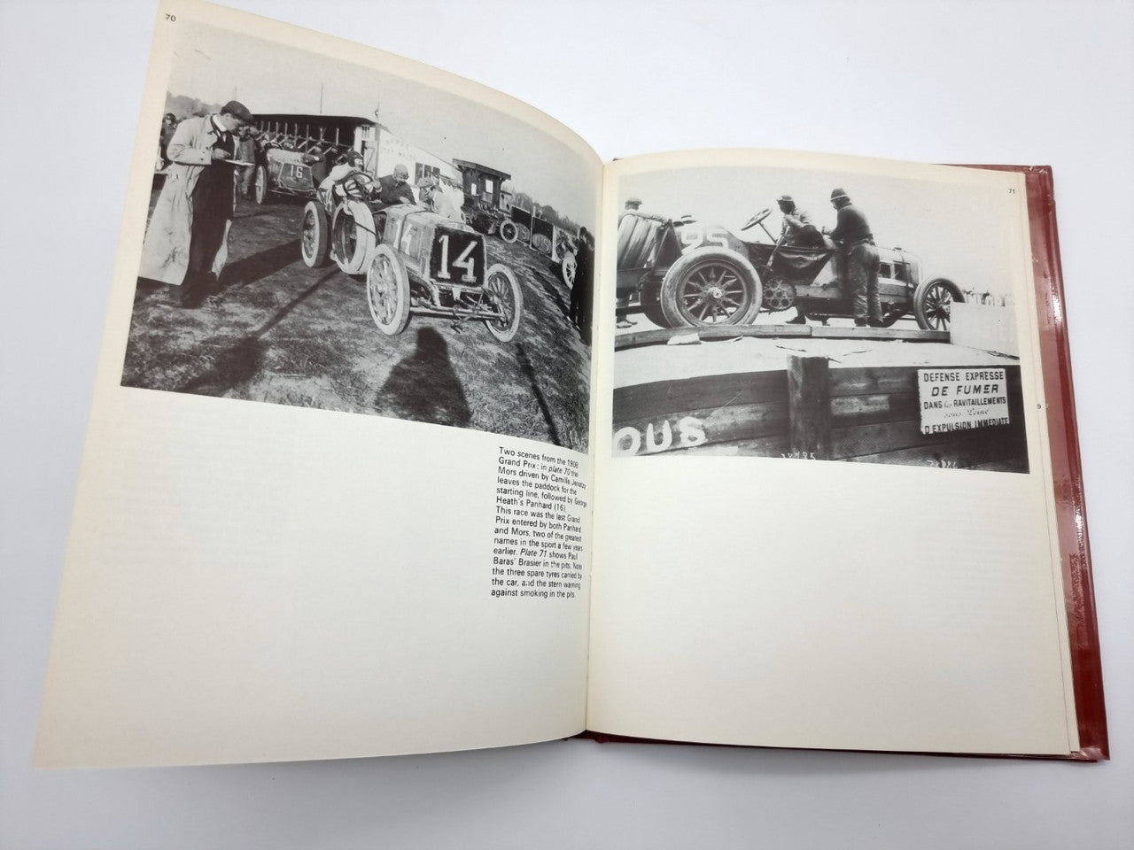 Open hardcover book with two black-and-white race-car photos and small captions