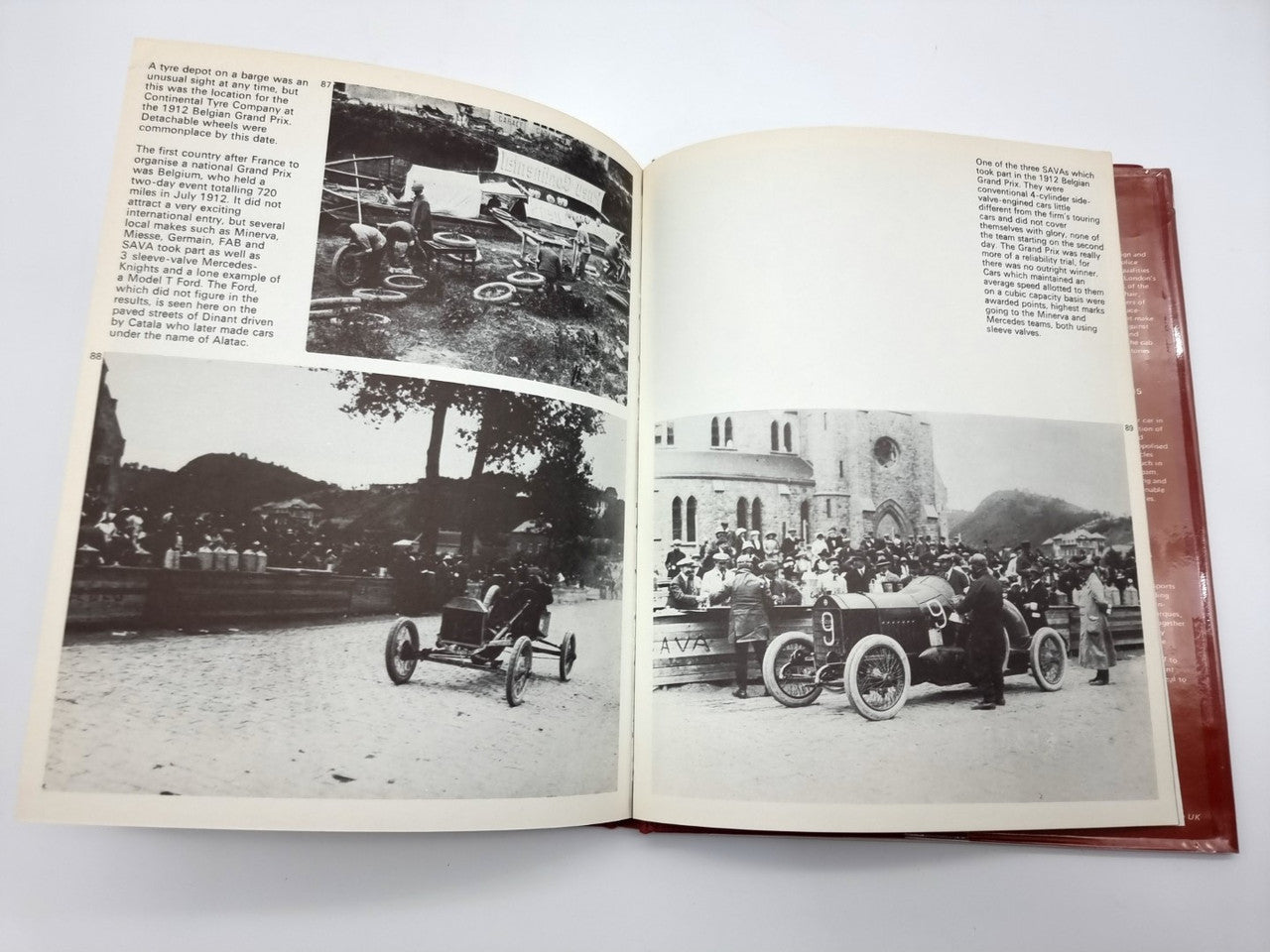 Open hardcover book with multiple black-and-white racing photos and caption text
