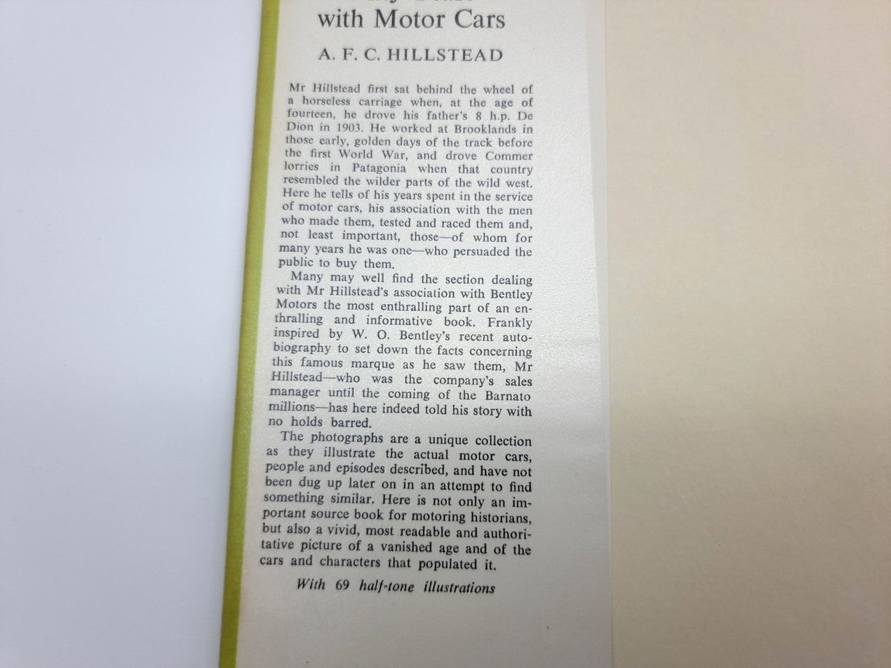 Book page with vertical printed text and a pale green cover border.