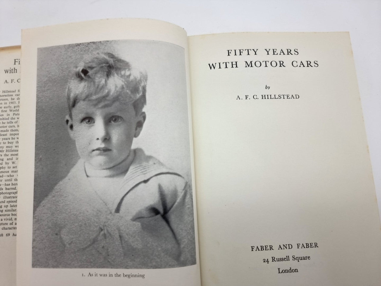 Book open to a title page with a grayscale portrait of a young child.