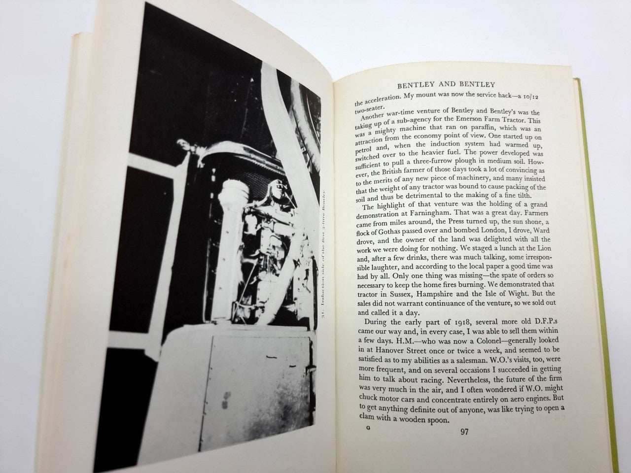 Open book spread with a large black-and-white photo and column of printed text.
