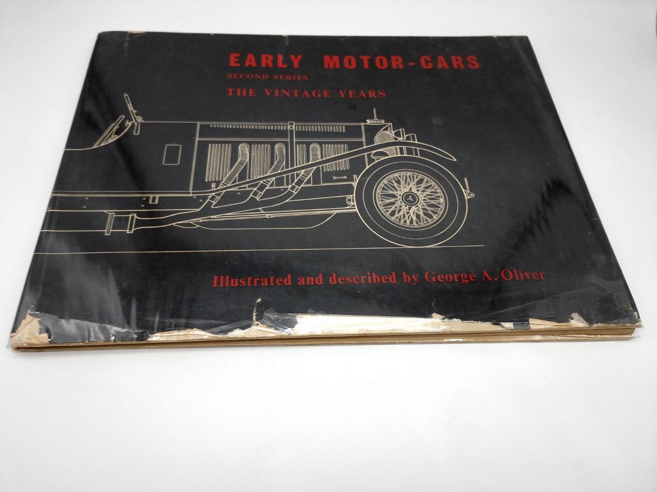 Early motor-cars book cover with illustrated vintage car and red title text