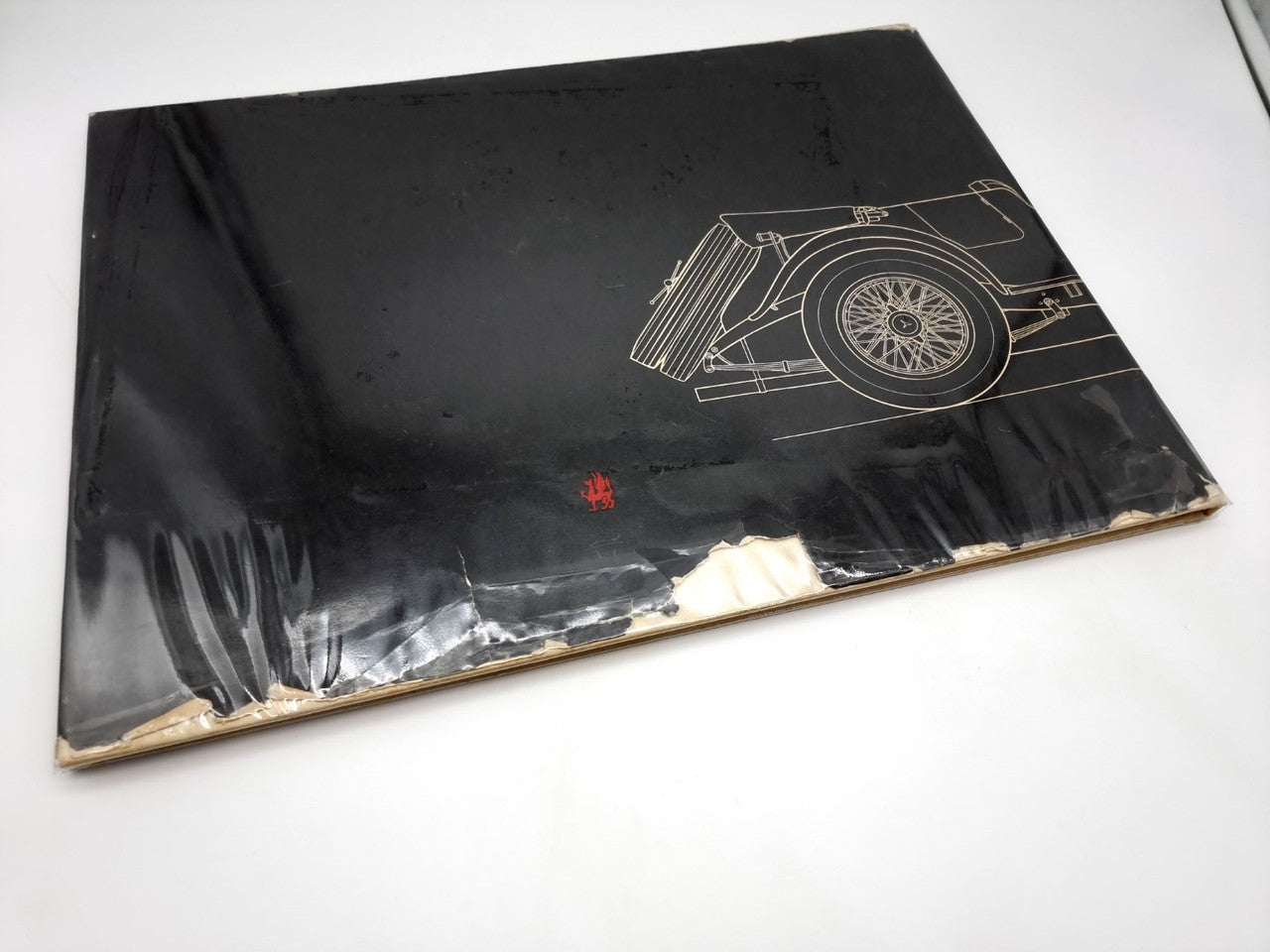 Early motor-cars book cover with illustrated vintage car wheel and chassis