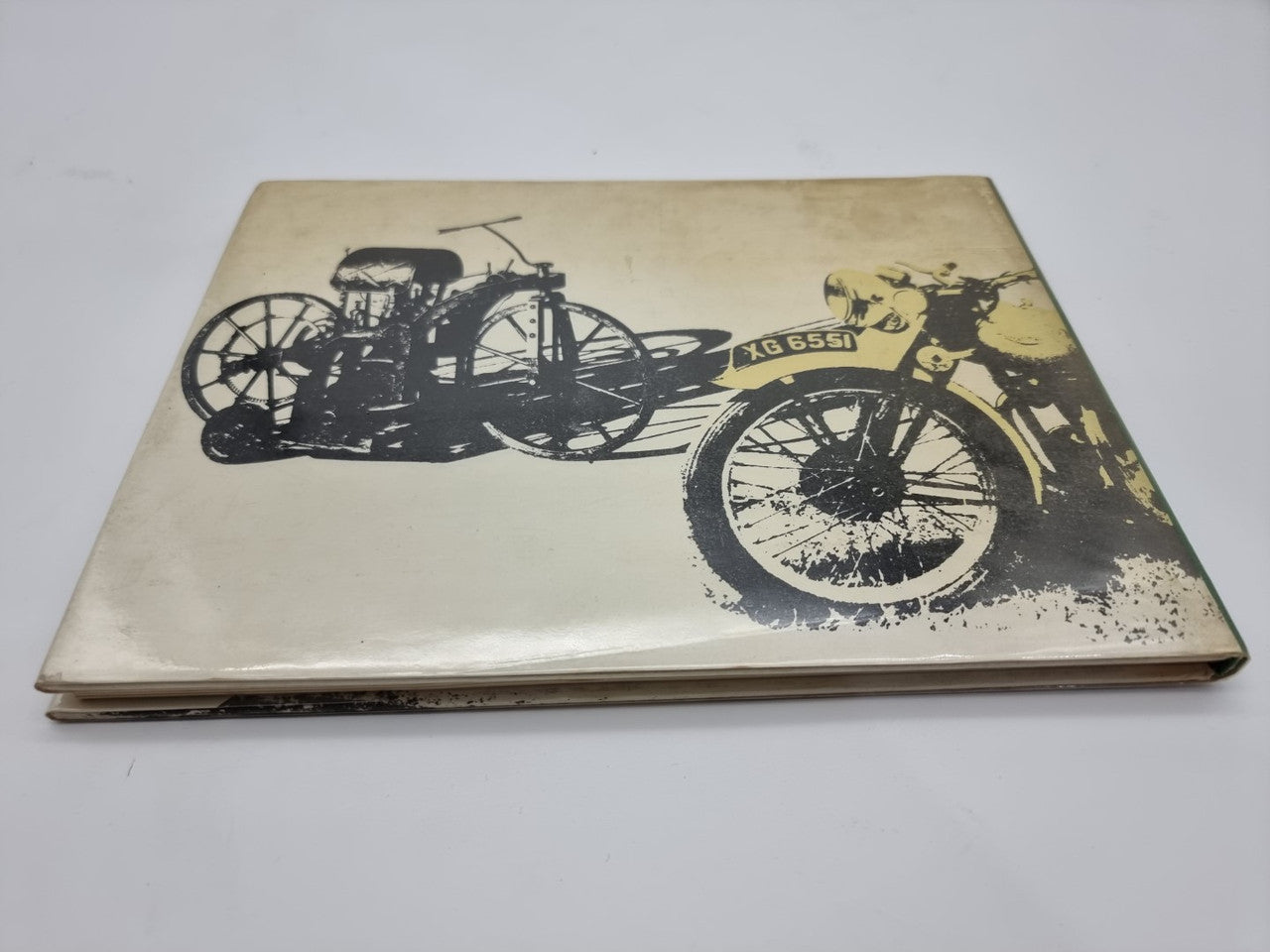Motorcycle book cover with vintage motorcycle line art in black and yellow graphics
