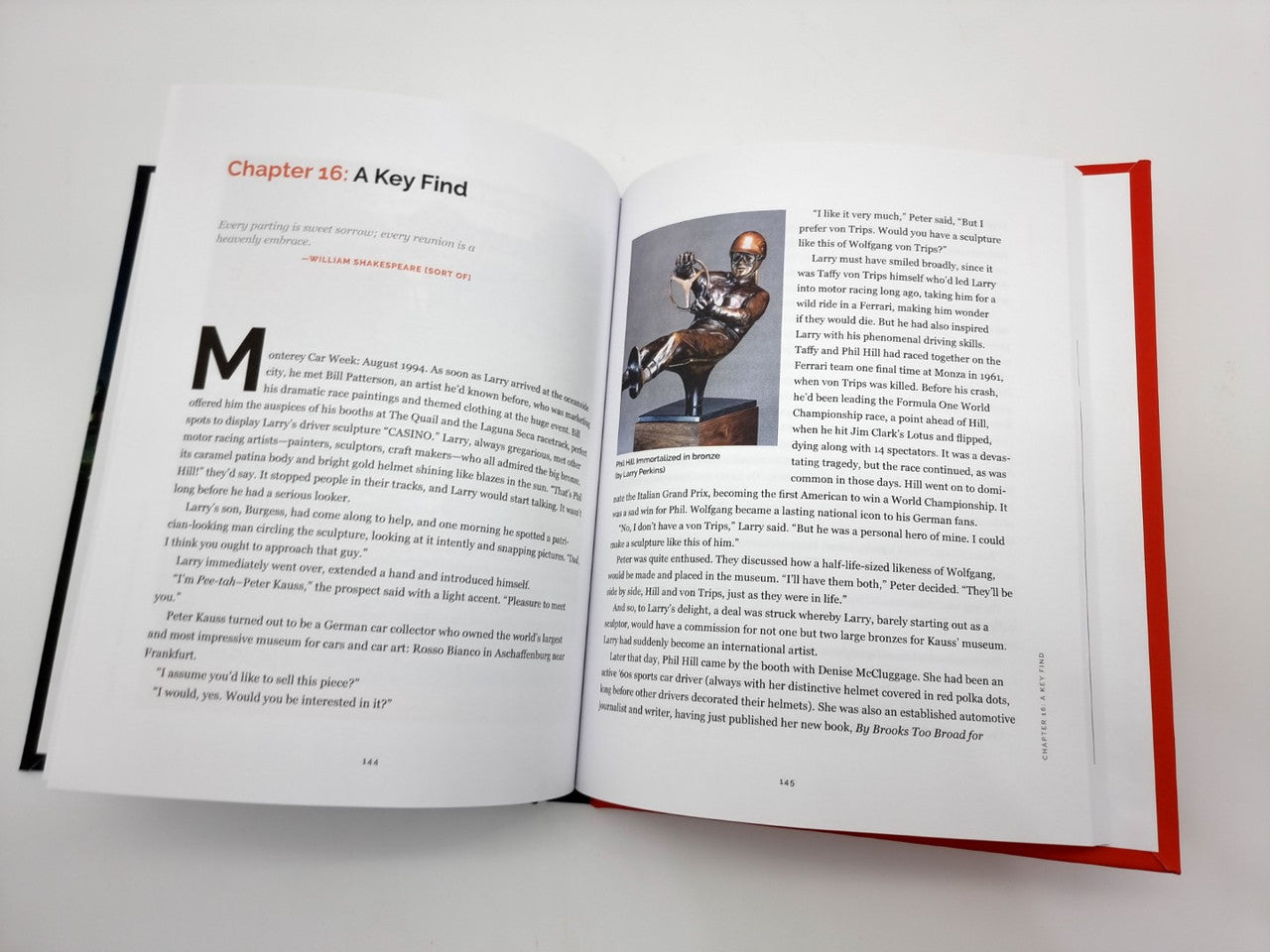 Hardcover book open to chapter layout with “Chapter 26: A Key Find” and a small bronze figure photo