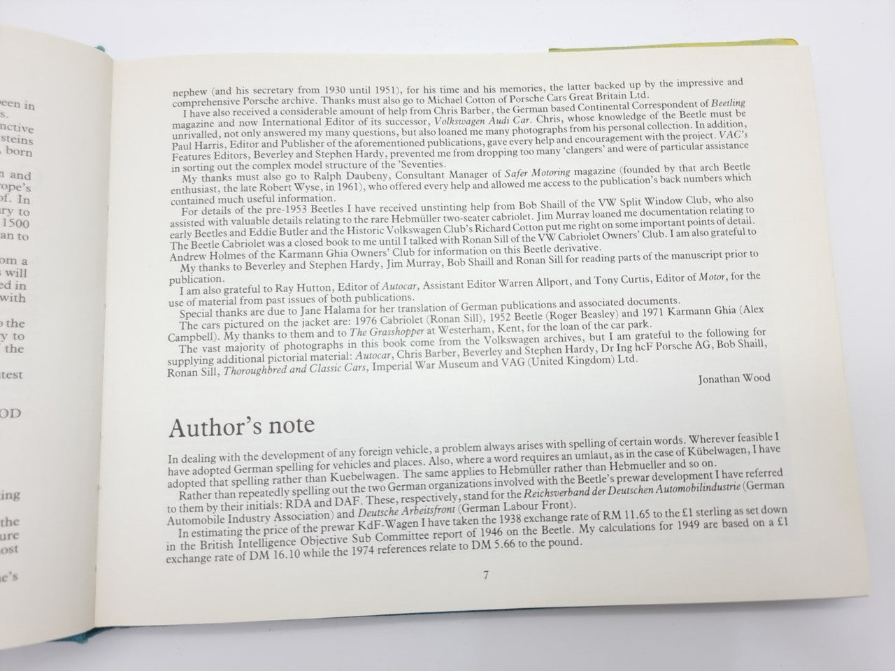 Open collector's guide book with printed text pages, bound spine visible.