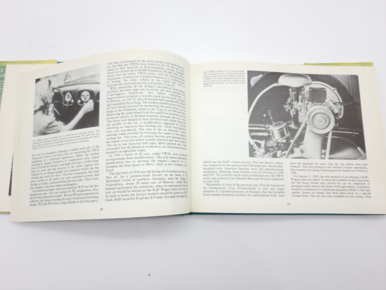Volkswagen Beetle guidebook open, black-and-white photos and text spread