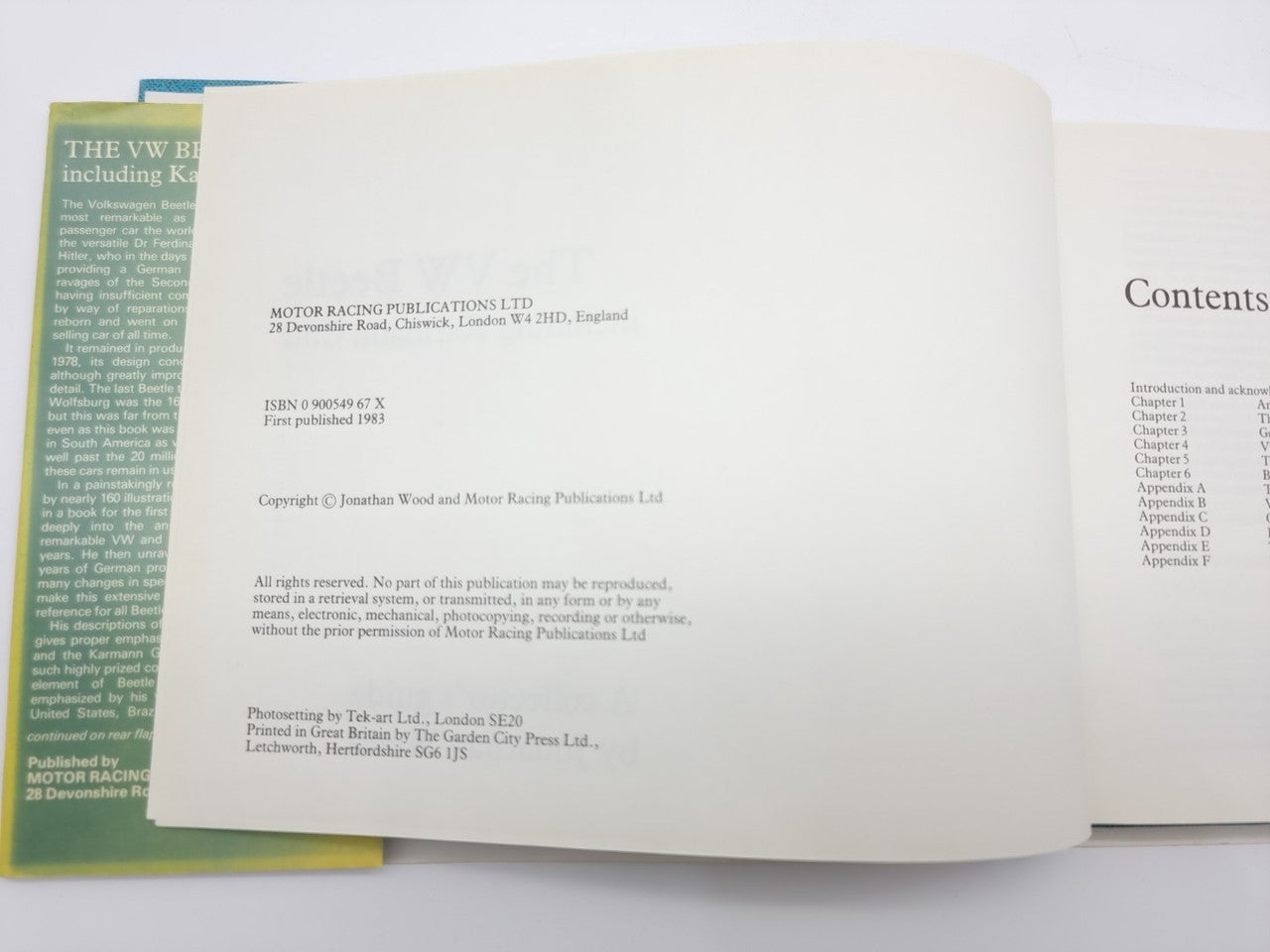 Volkswagen Beetle guidebook open, publication details and contents section