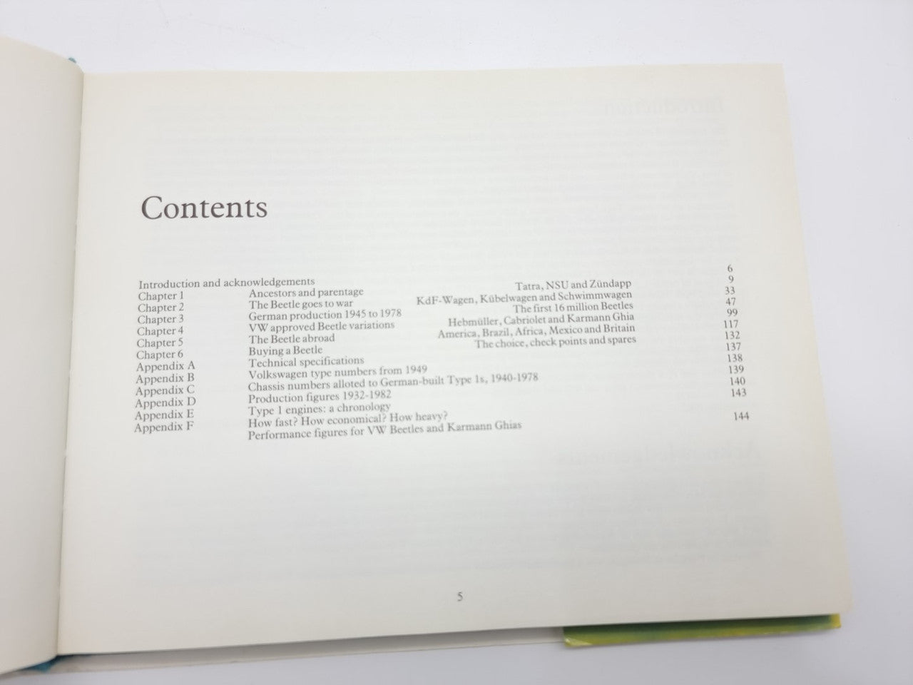 Volkswagen Beetle guidebook open, contents page listing chapters