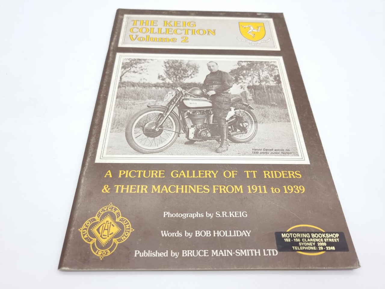 Vintage motorcycle photo book, brown cover with TT riders and their machines image