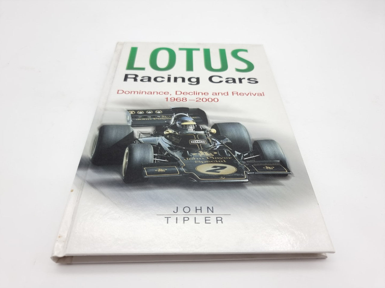 Hardcover racing cars book cover with LOTUS logo, F1 car photo, John Tipler