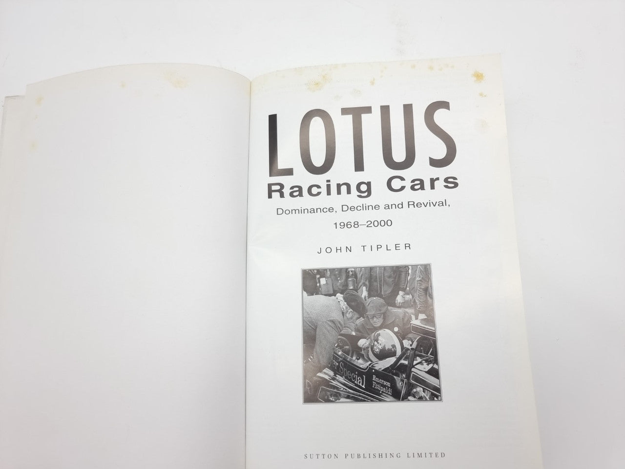 Auto racing history book, showing cover with large LOTUS title and author name