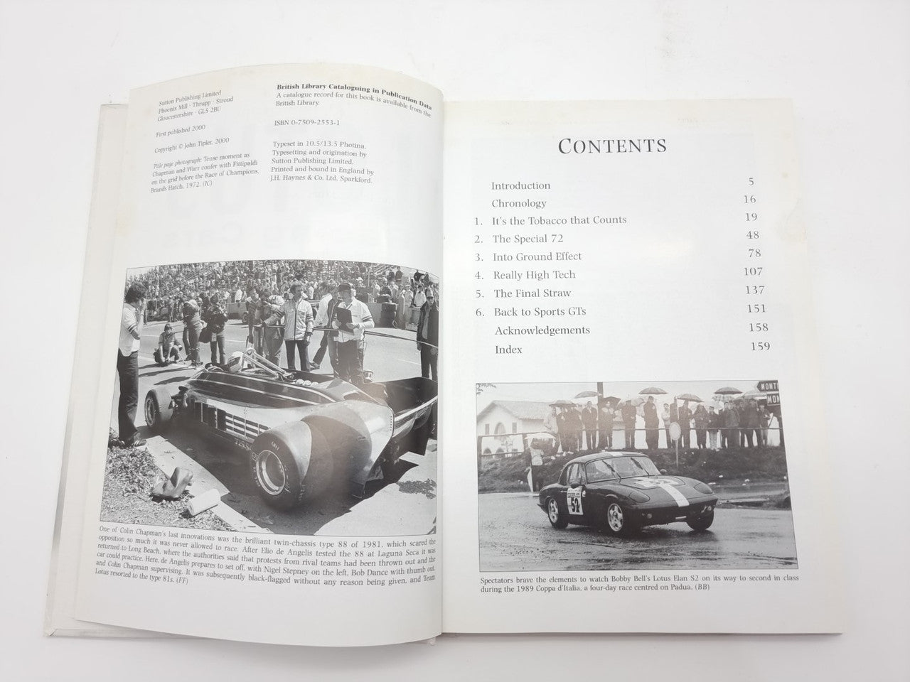 Open auto racing history book showing contents list and section headings