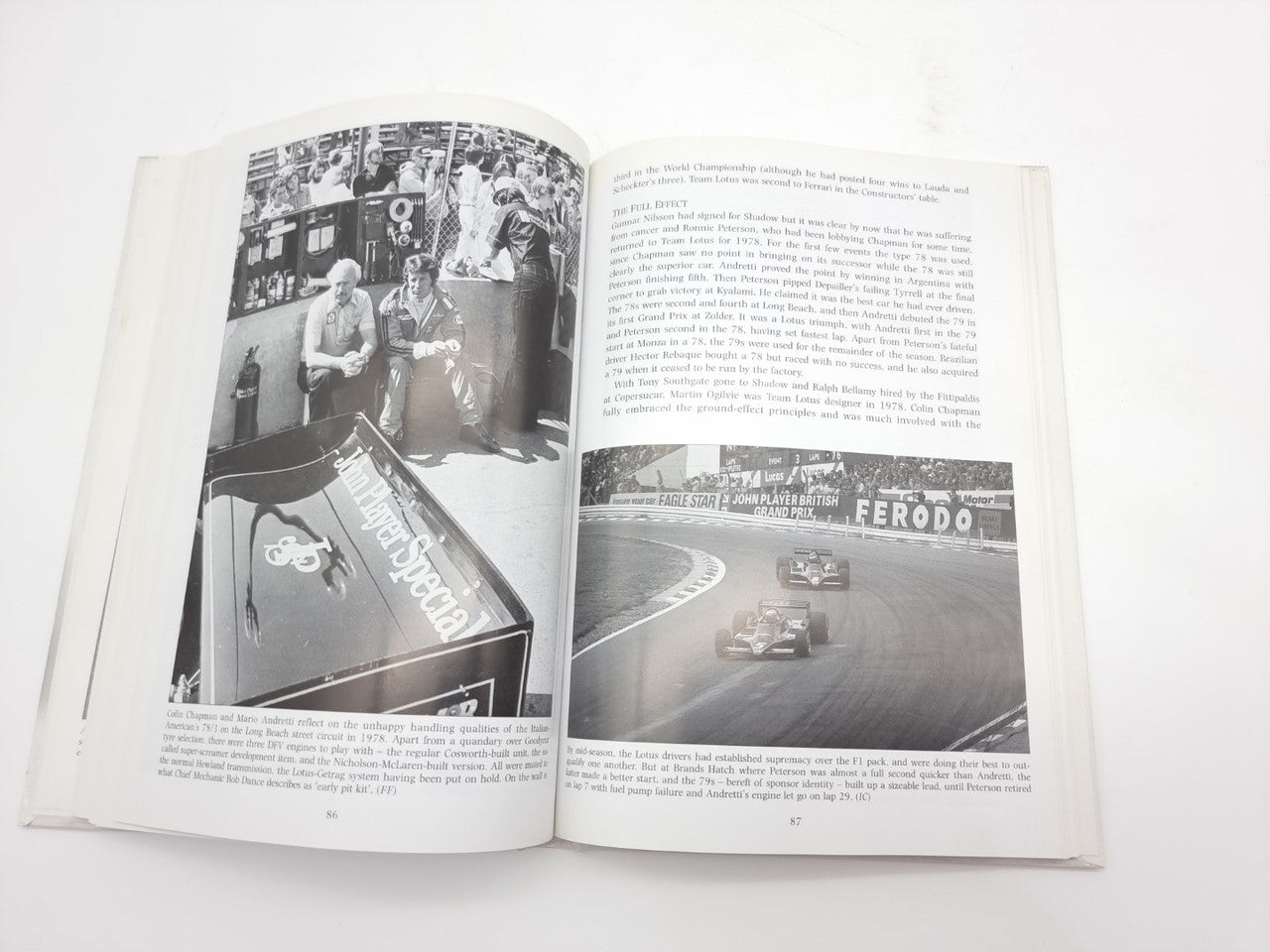 Open racing cars book with black-and-white photos and text on both pages