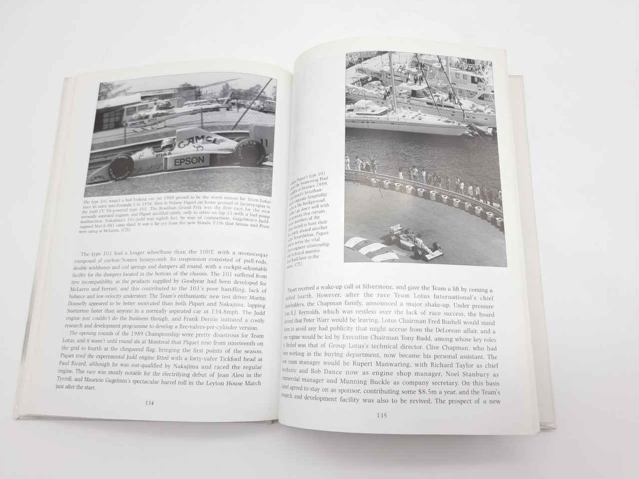Open auto racing history book with two black-and-white photo pages and paragraphs