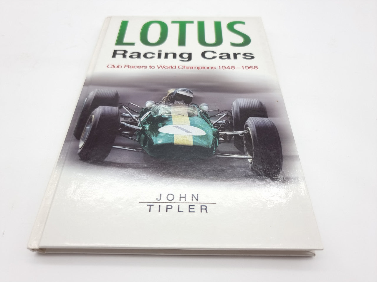 Lotus Racing Cars book with green race car cover photo and title