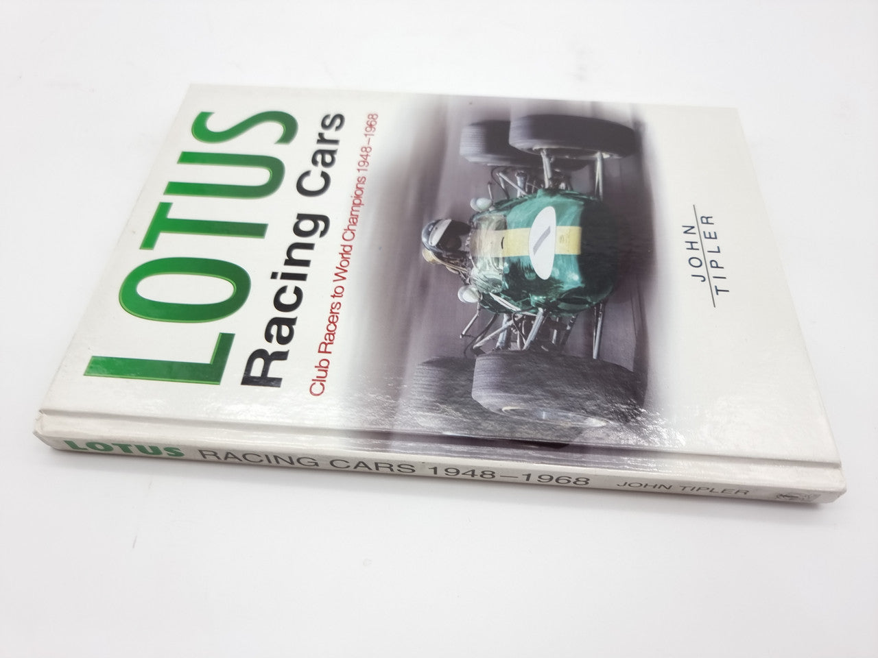 Lotus Racing Cars book front cover with green title and race car engine image