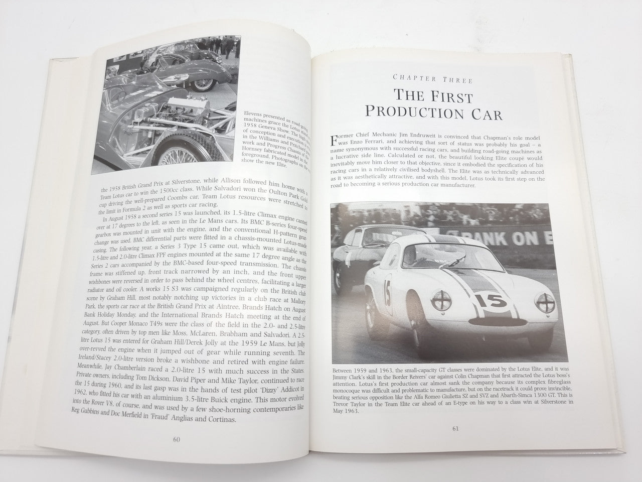 Open book spread with race car photo and printed chapter text on both pages