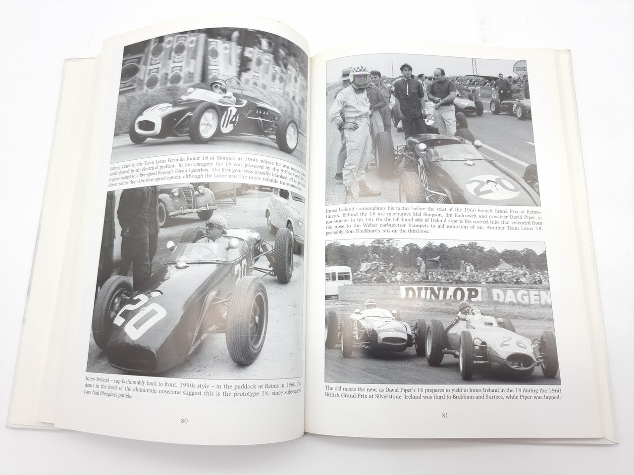 Open book spread with multiple vintage race car photos and captions on pages
