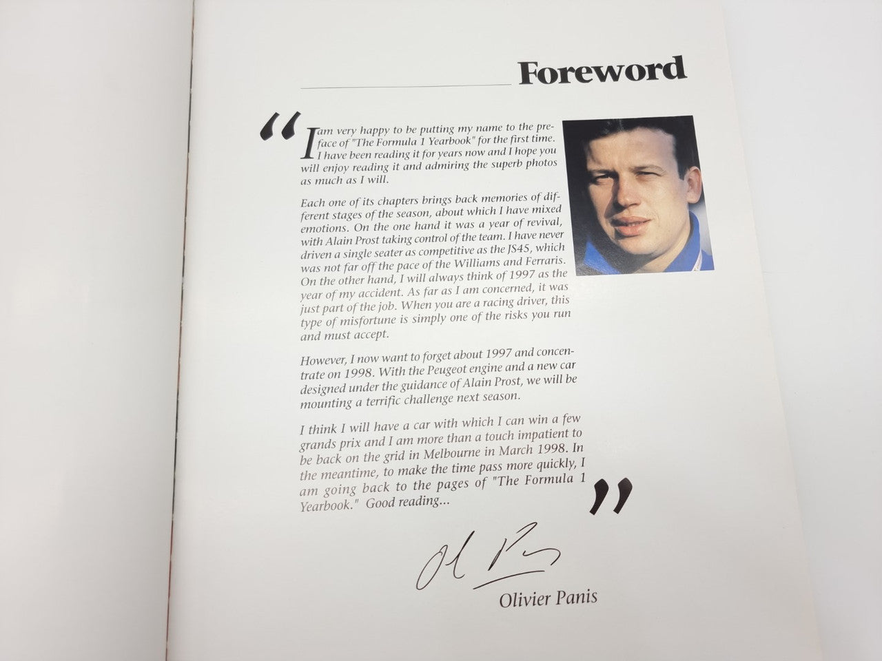 Formula 1 yearbook foreword page with portrait photo and signature