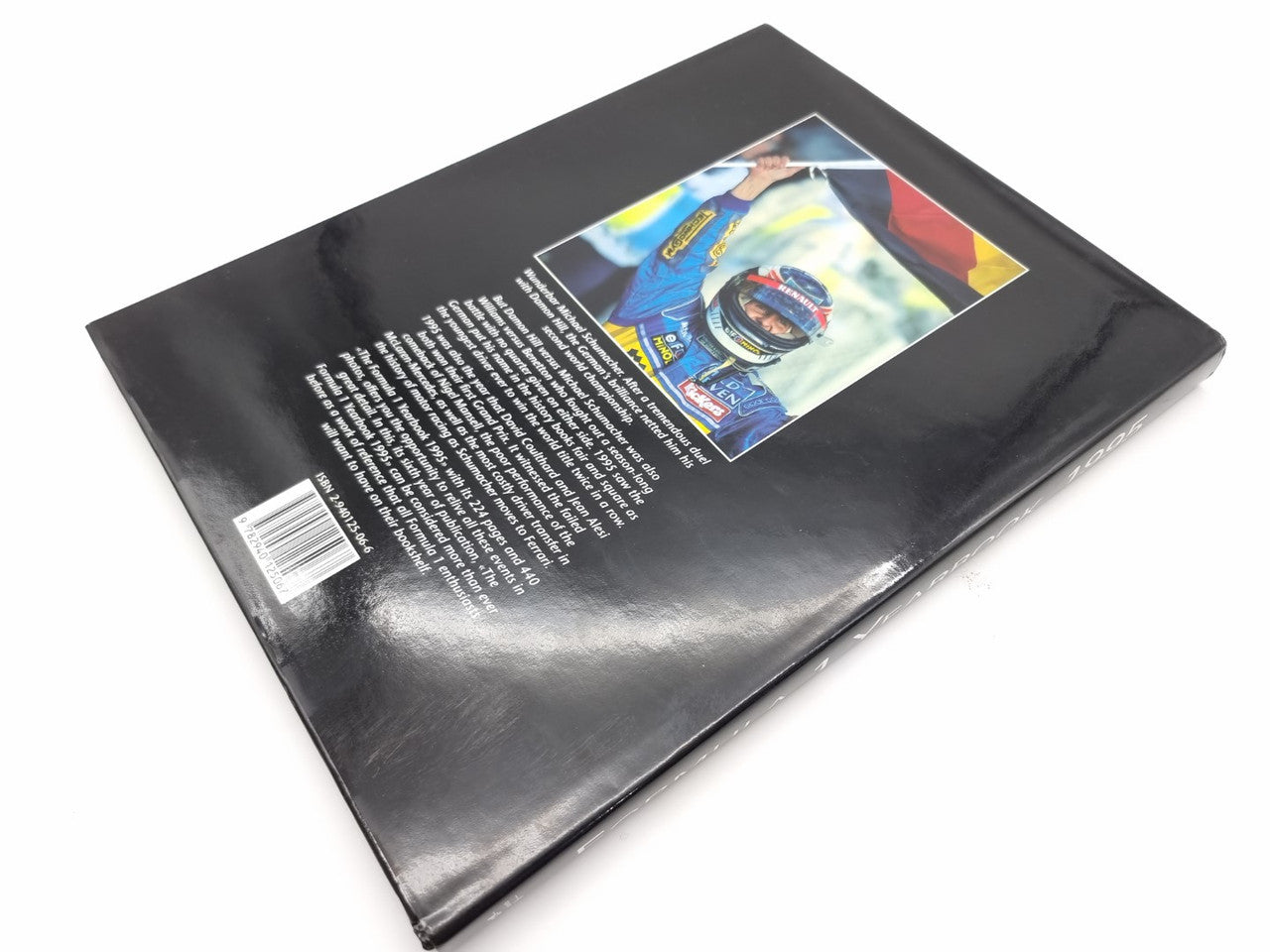 Formula 1 Yearbook 1995 closed hardcover with car photo and description text