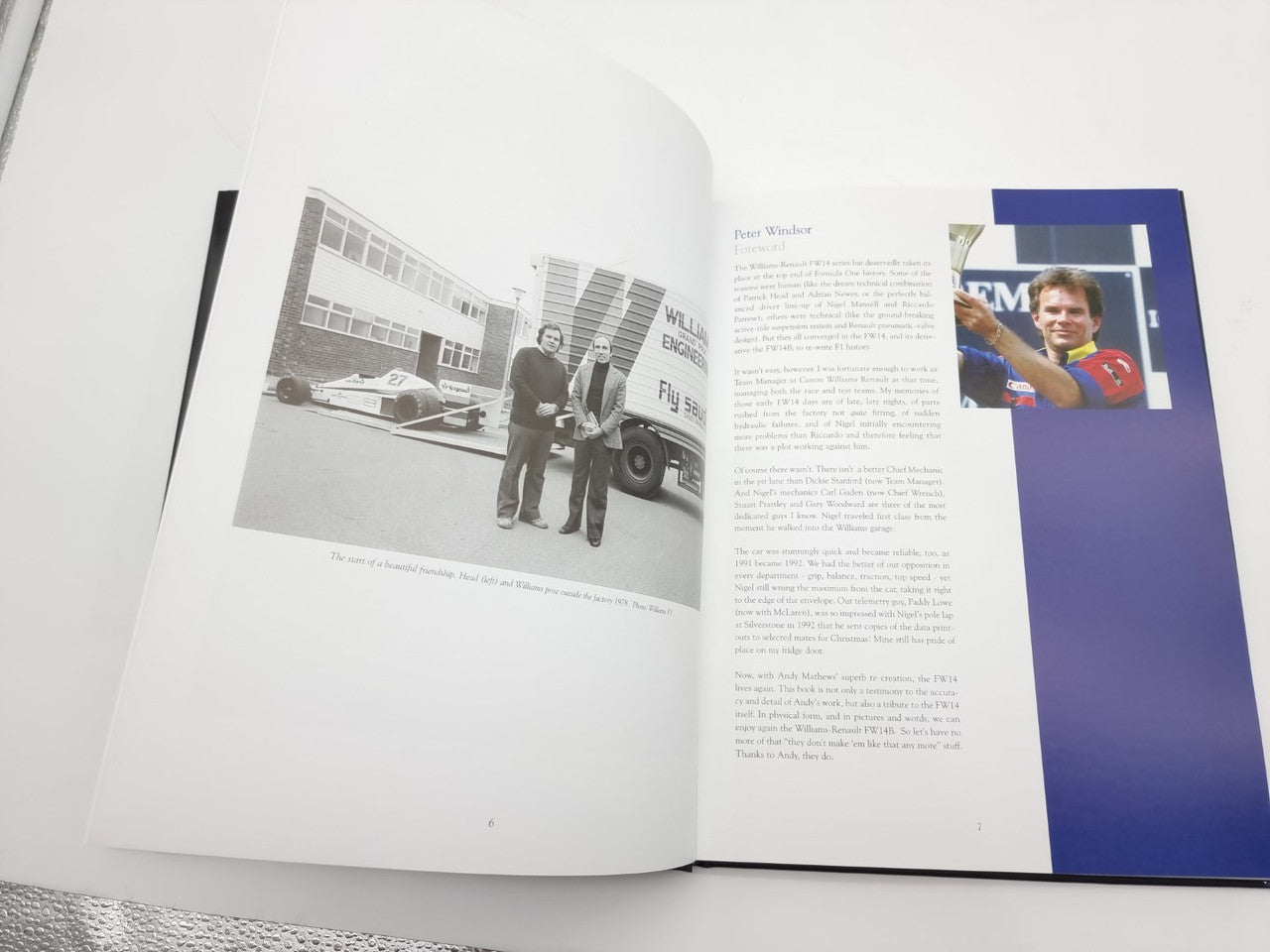 Open photo book spread with black-and-white team photo and portrait inset on right page