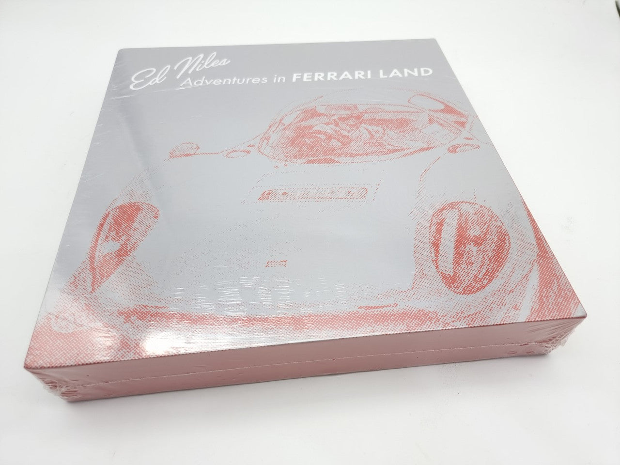 Hardcover book set box top with red racing car illustration and title