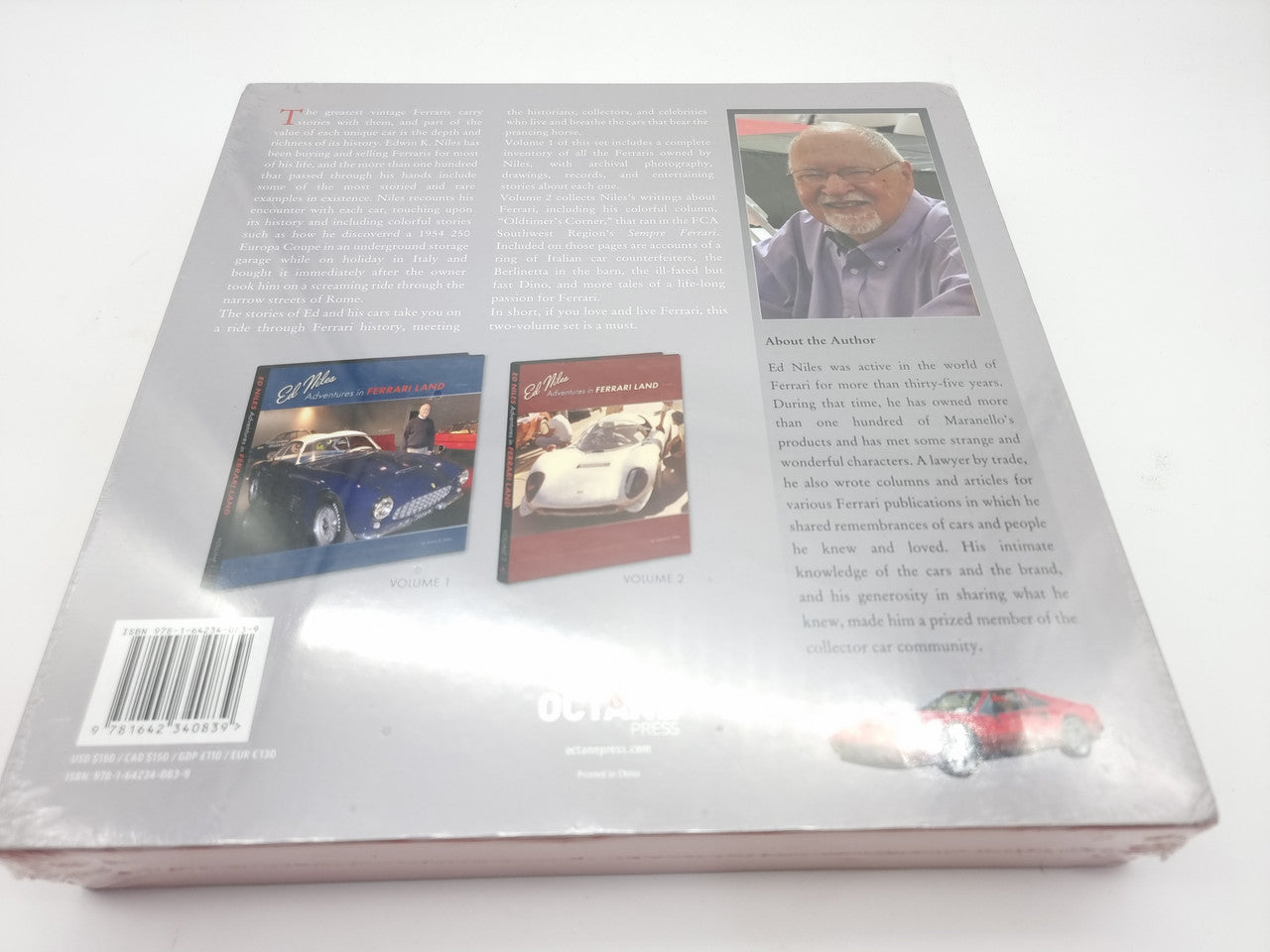 Hardcover book set with photos and text pages, open view