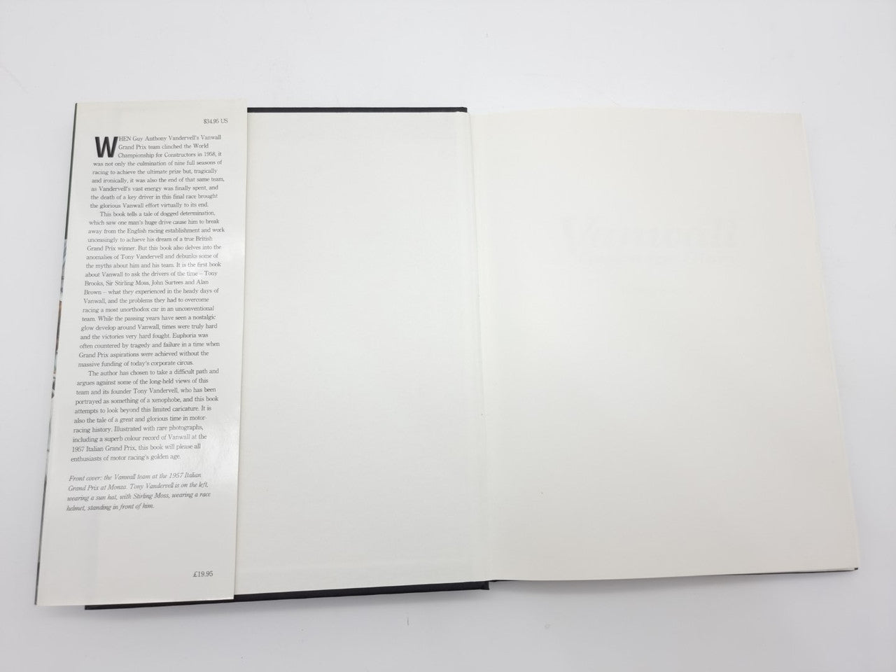 Open motorsport book with left page text and blank white right page