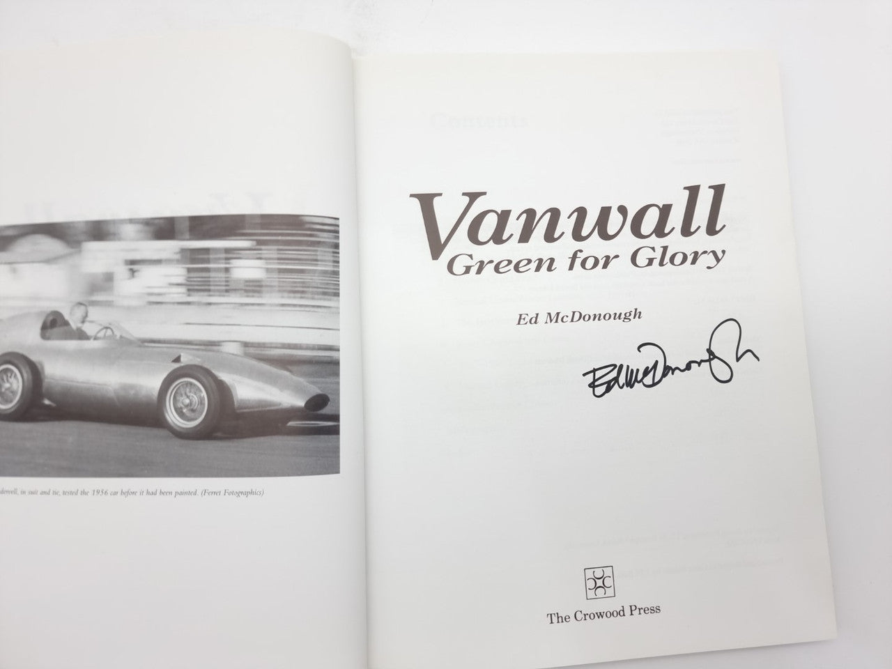Signed motorsport book with white cover, Vanwall title, and Ed McDonough autograph