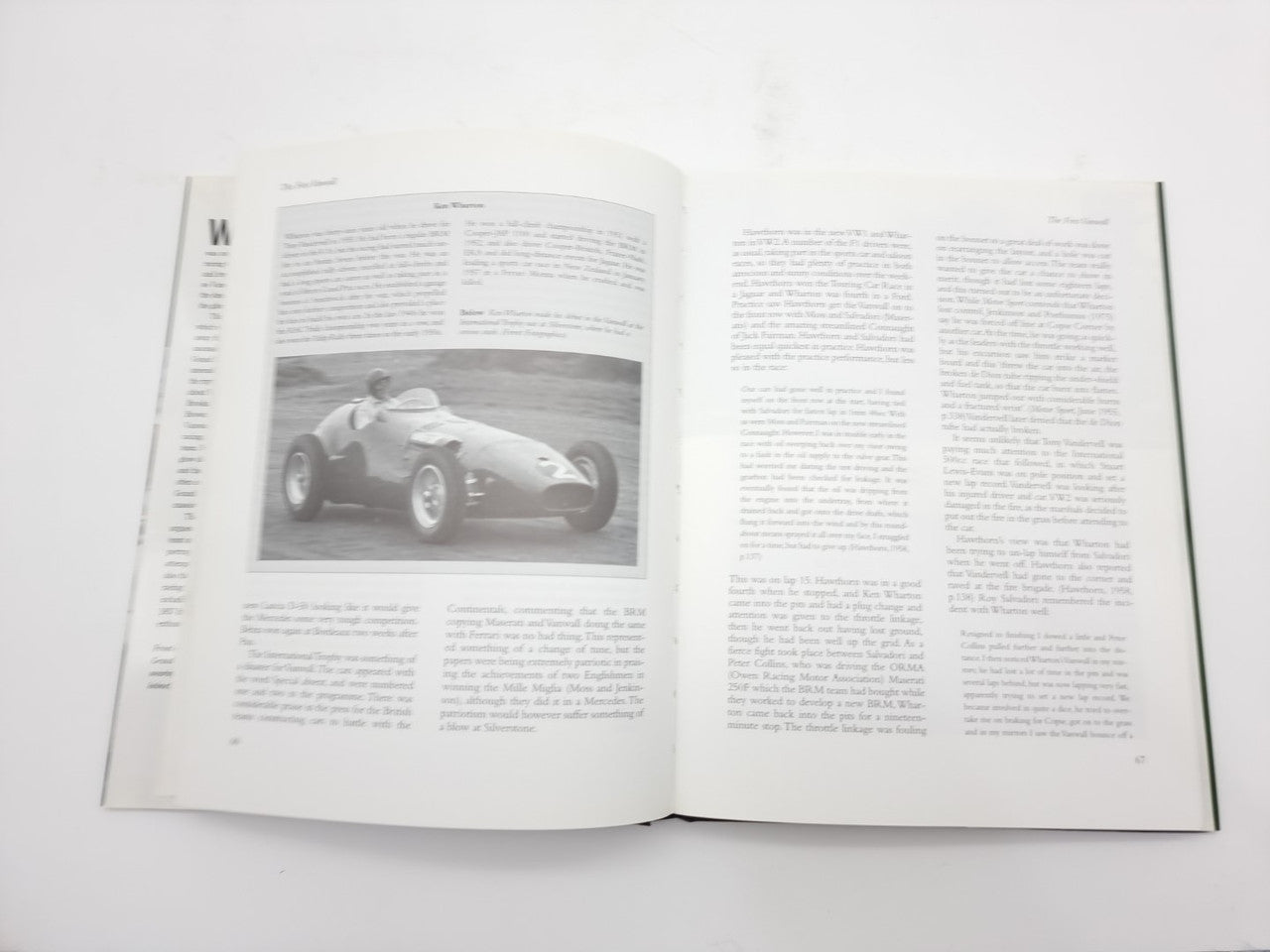 Open motorsport book page with black-and-white car photo and paragraphs