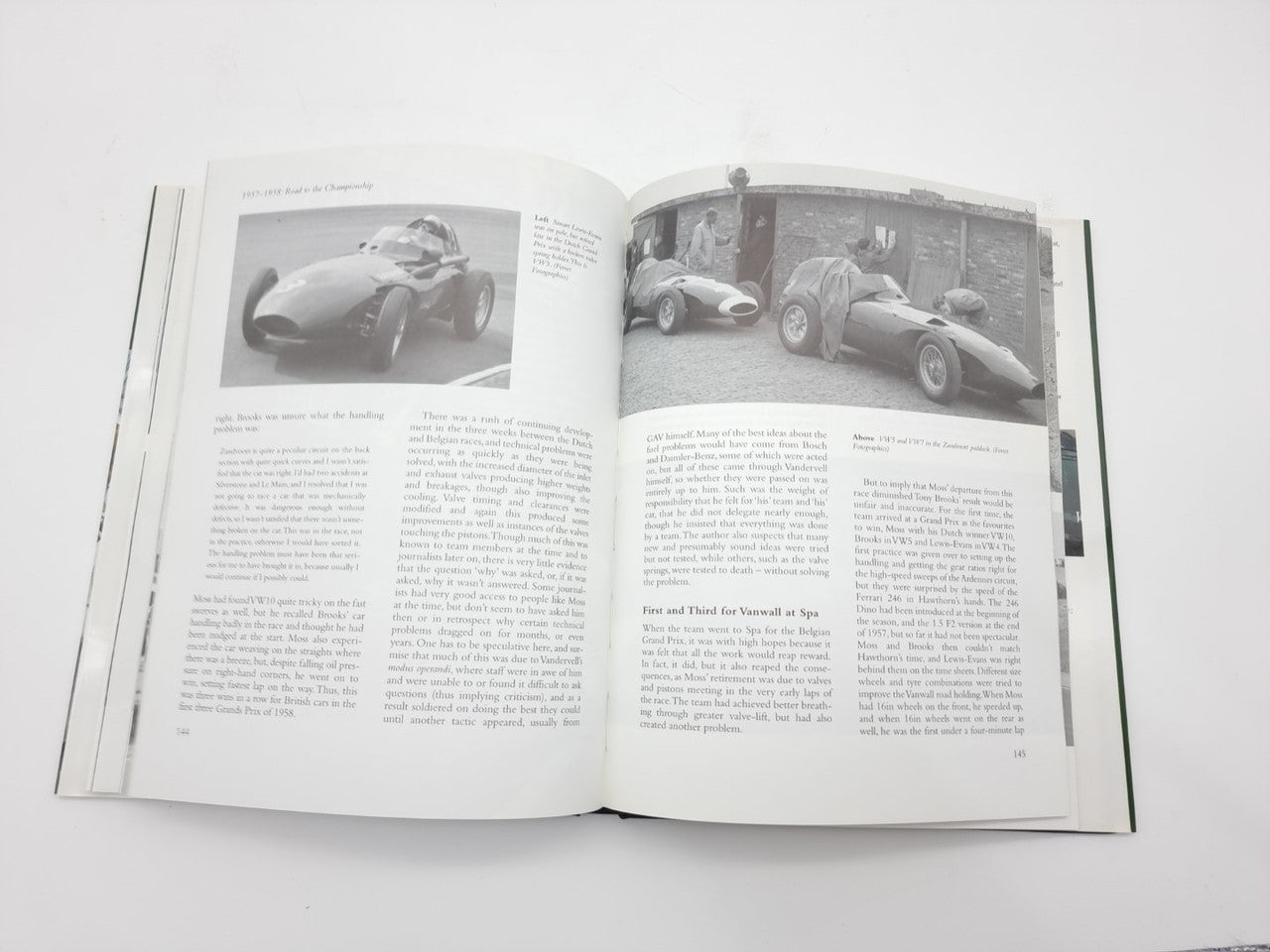 Open motorsport book spread with two black-and-white race car photos and text