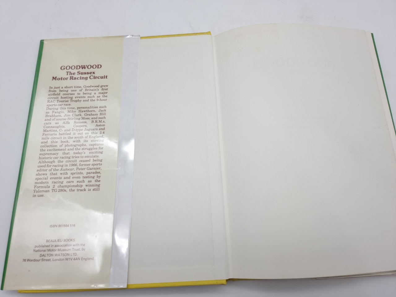 Open hardcover book with Goodwood title page text on the left and blank pages on right.