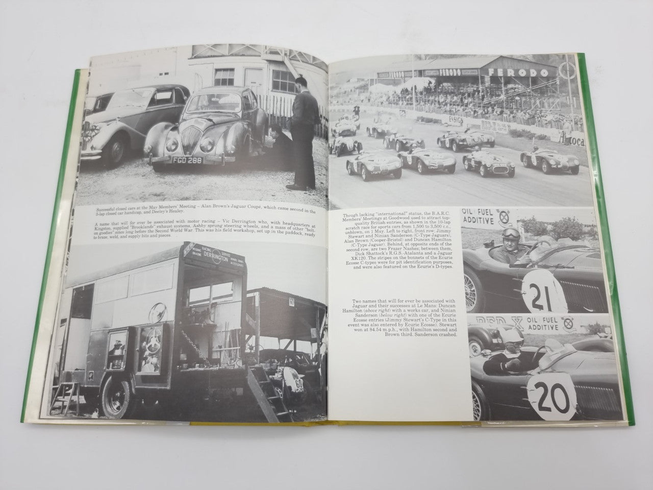 Open hardcover racing history book with black-and-white photos of cars, pits, and crowds.