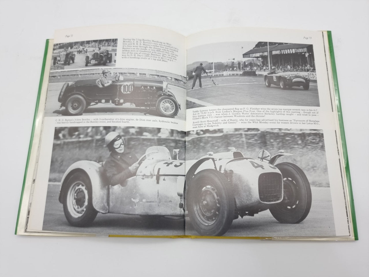 Open hardcover racing history book showing two vintage race cars in black-and-white photos.