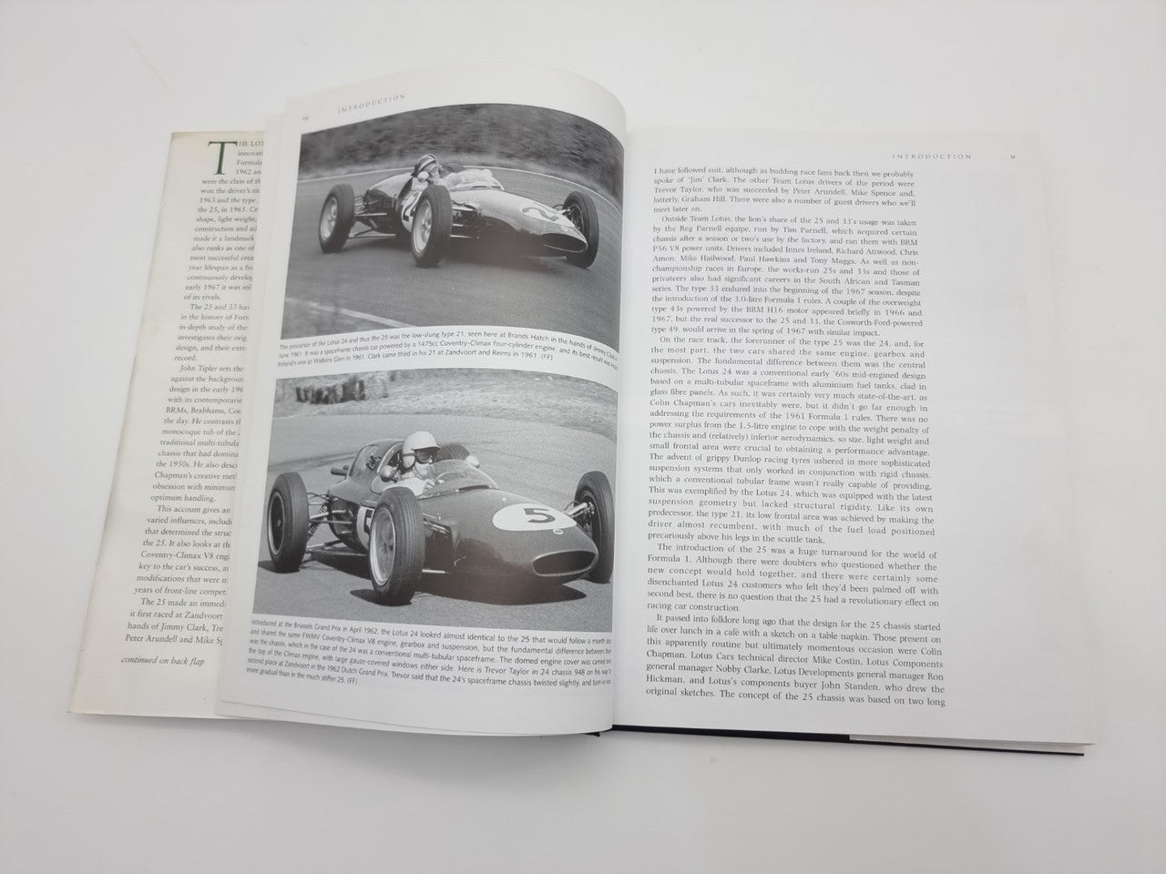 Open Lotus 25 & 33 book featuring grayscale car photos on the left page