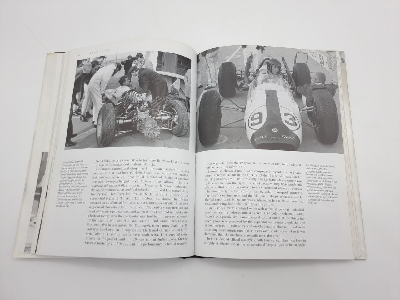 Open Lotus 25 & 33 book showing two grayscale photo pages with paragraphs