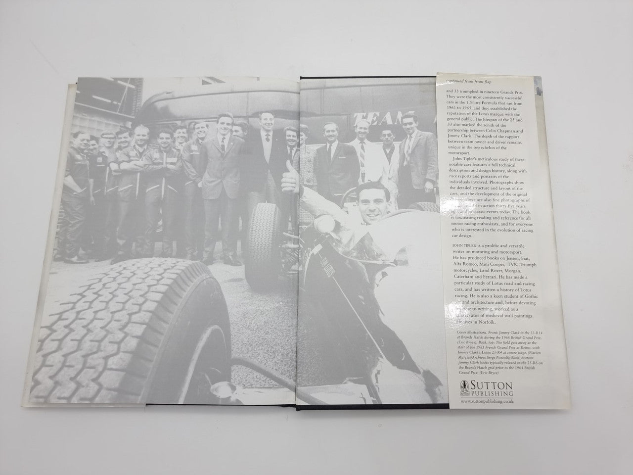 Open Lotus 25 & 33 book with group portrait on left and text on right