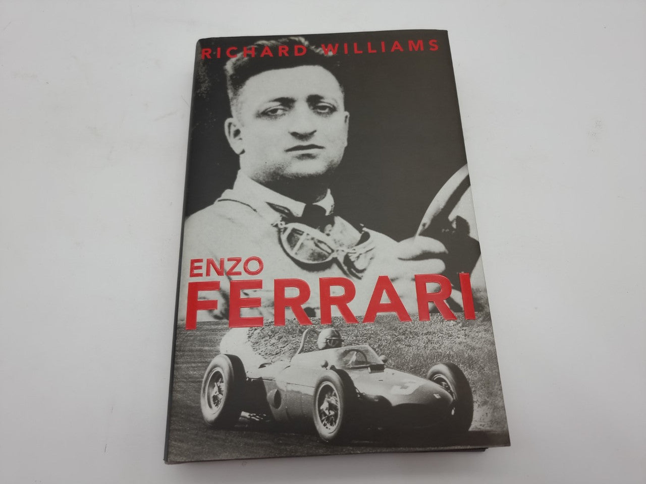 Hardcover book front cover with Richard Williams name and large red Enzo Ferrari text