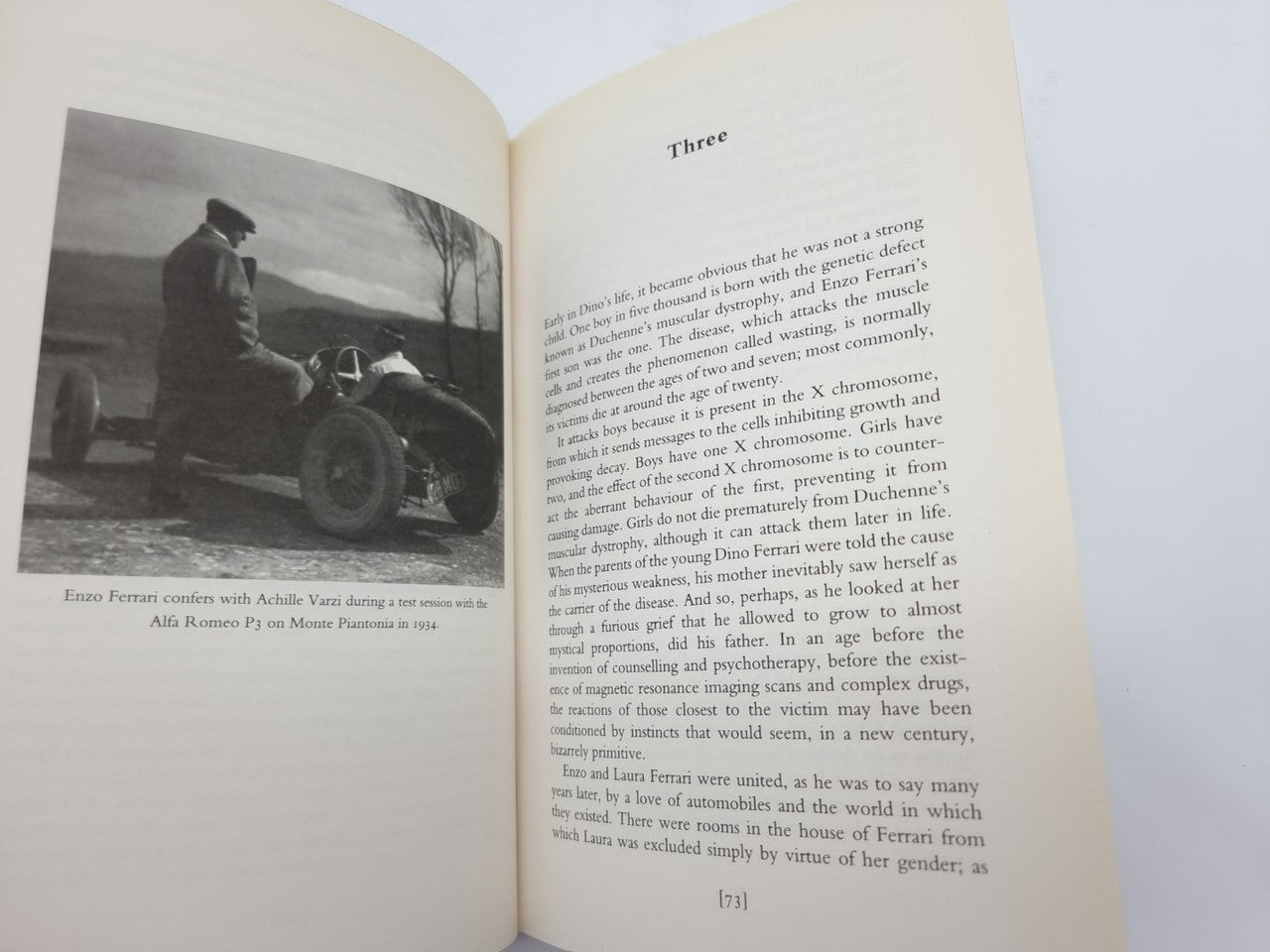 Open book spread with black-and-white photo caption on the left and text on the right