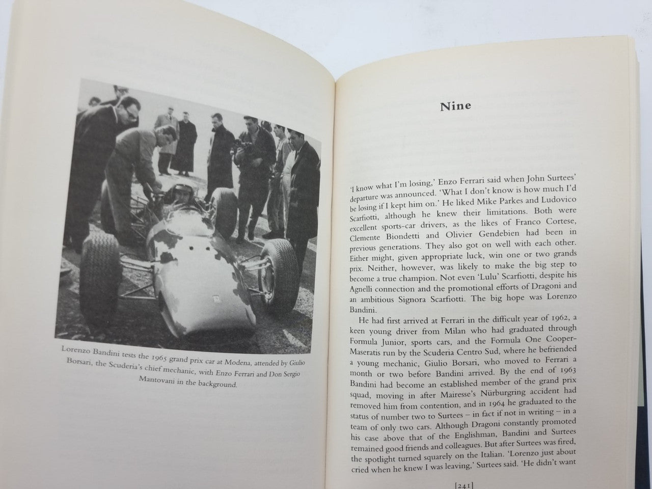 Open book spread with black-and-white group photo on the left and text on the right