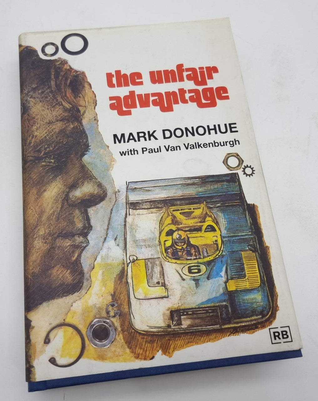 Hardcover book front cover close-up with 'the unfair advantage' and Mark Donohue
