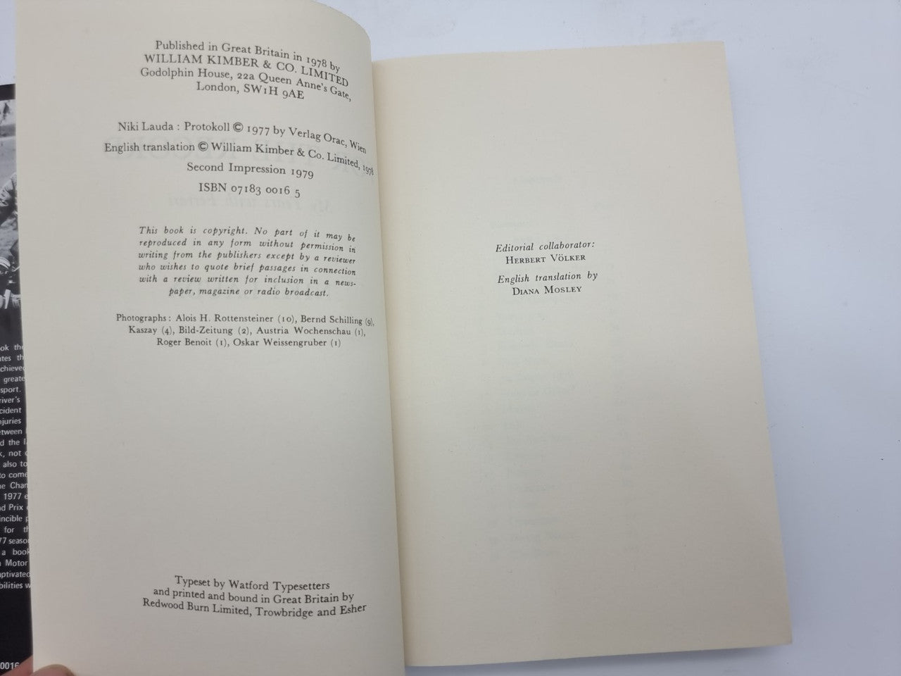 Book copyright page with printed text on left and blank cream page on right.
