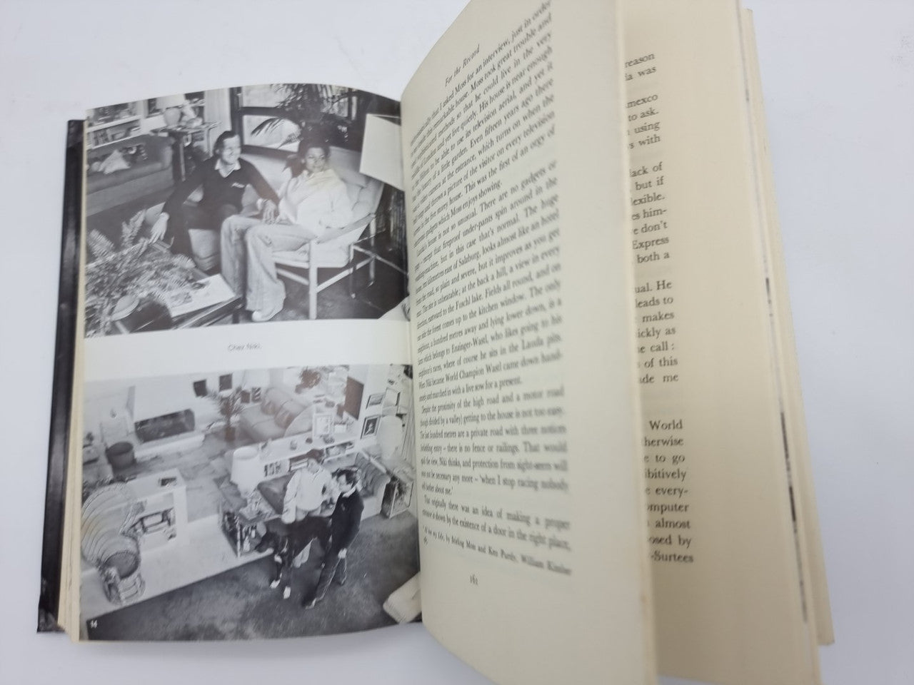 Opened book spread with two black-and-white photos on left and dense text on right.